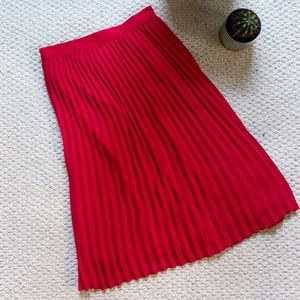 Red pleated midi skirt